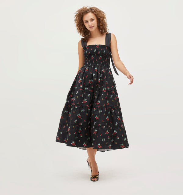 Gabriella wears a size XS in the Black Ikat Floral Taffeta color: Black Ikat Floral Taffeta