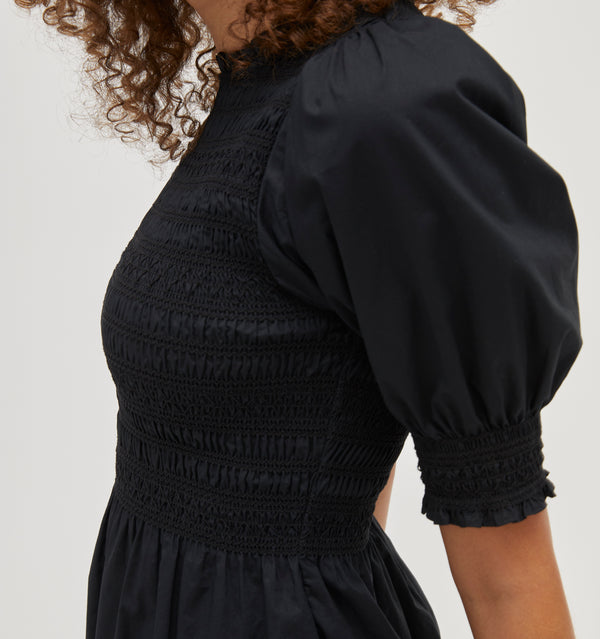 Gabriella wears and XS in the Black Cotton color:black cotton