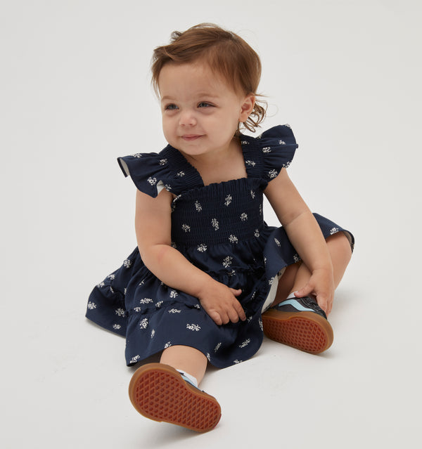 Brooklyn wears a 12-18M in the Navy Autumn Paisley color: Navy Autumn Paisley