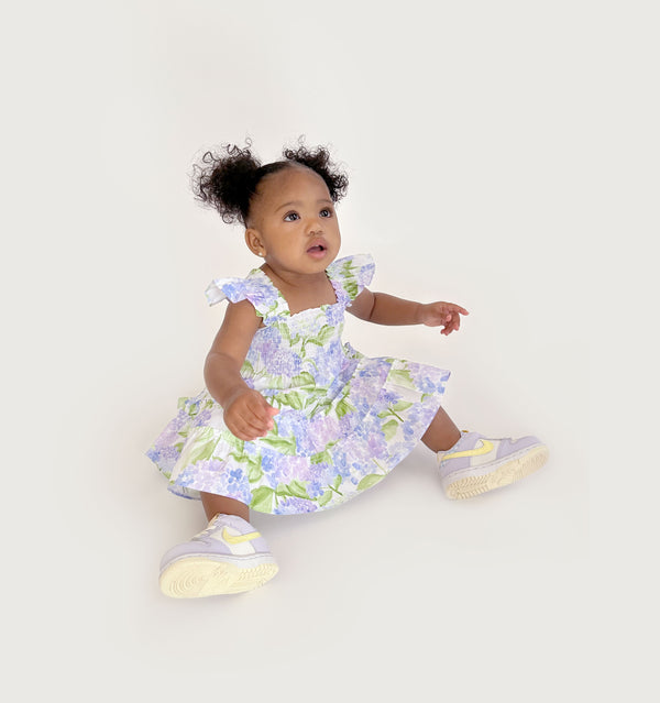 Ka’lani wears a size 12-18M in the Blue Hydrangea Cotton color: Blue Hydrangea Cotton
