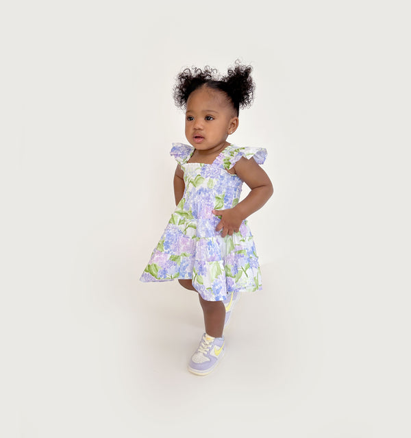 Ka’lani wears a size 12-18M in the Blue Hydrangea Cotton color: Blue Hydrangea Cotton