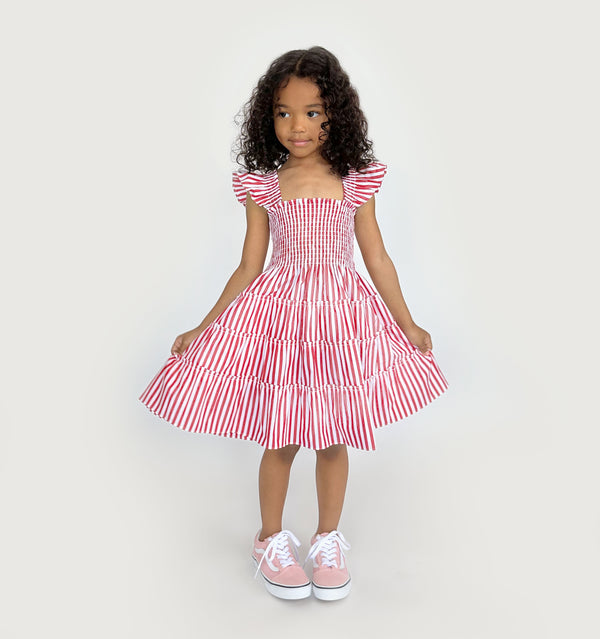 Navy wears a 5-6Y in the Cherry Stripe color: Cherry Stripe