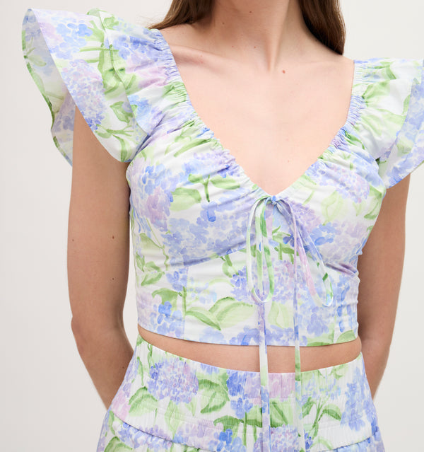 Lillian wears a size XS in the Blue Hydrangea Cotton  color: Blue Hydrangea Cotton