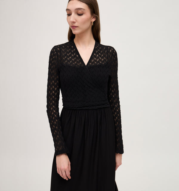 Lillian wears a size XS in the Black Raschel Knit color: Black Raschel Knit