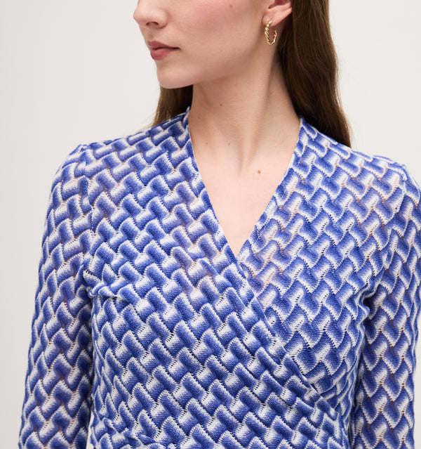 Lillian wears a size XS in the Blue Multi Raschel Knit color: Blue Multi Raschel Knit