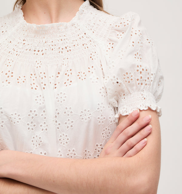 Lillian wears a size XS in the White Eyelet color: White Eyelet