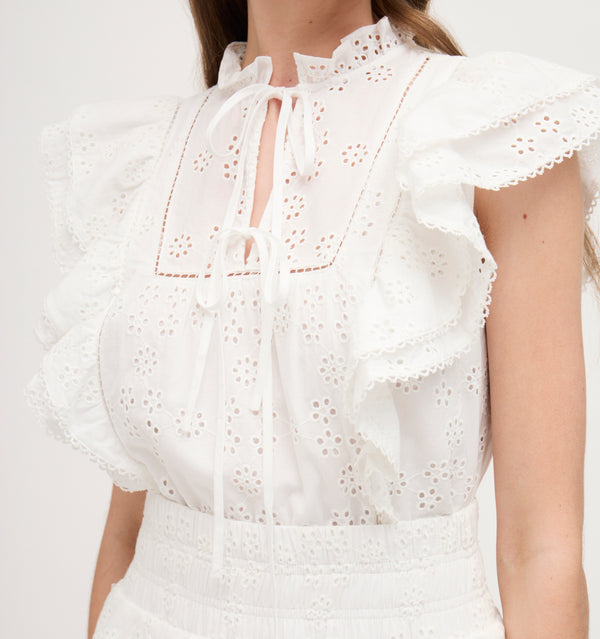 Lillian wears a size XS in the White Eyelet color: White 