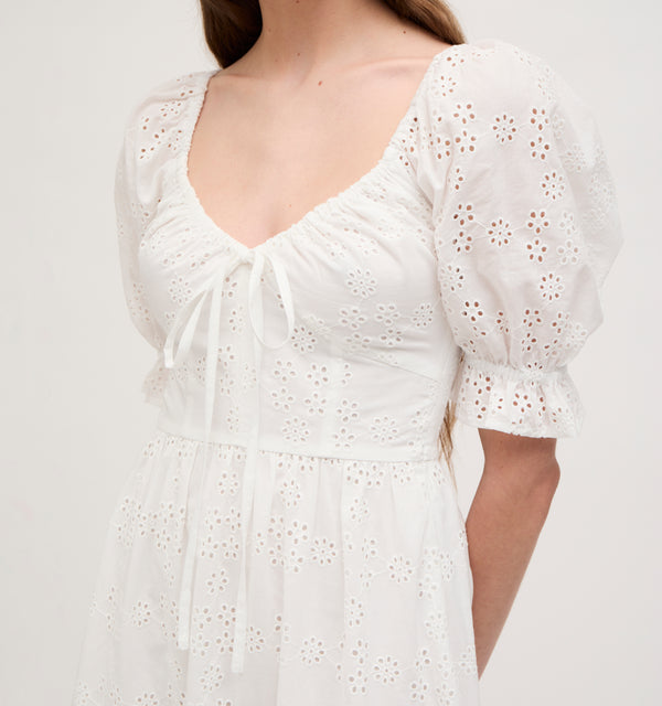 Lillian wears a size XS in the White Eyelet color: White Eyelet