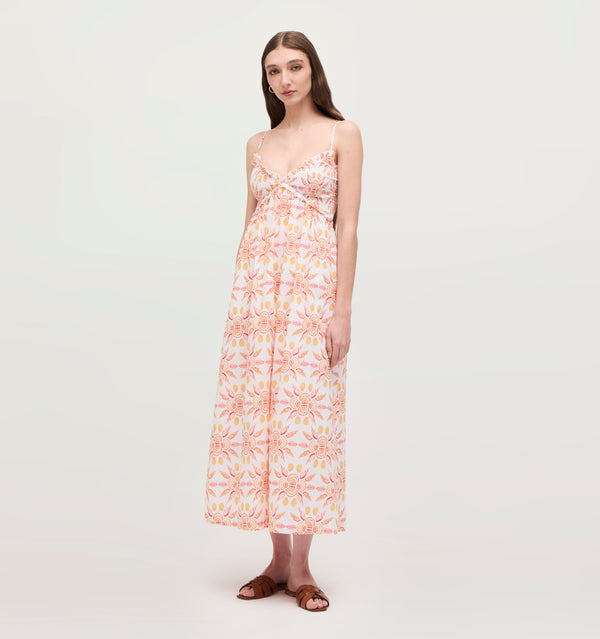 Lillian wears a size XS in the Orange Shell Mosaic Cotton color: Orange Shell Mosaic Cotton