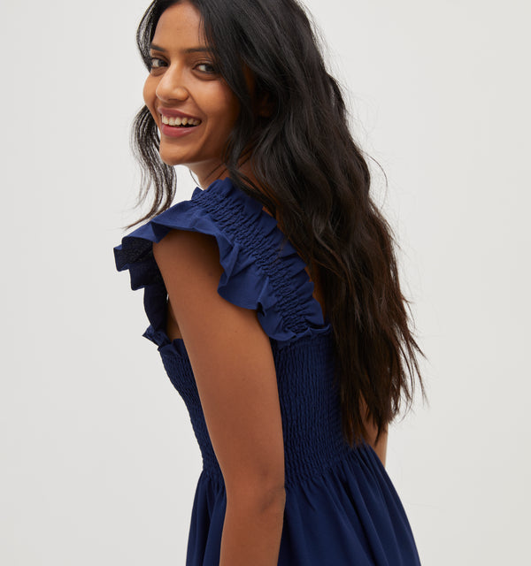 Palak wears a size XS in Navy Crepe color: Wrinkle Resistant Navy Crepe