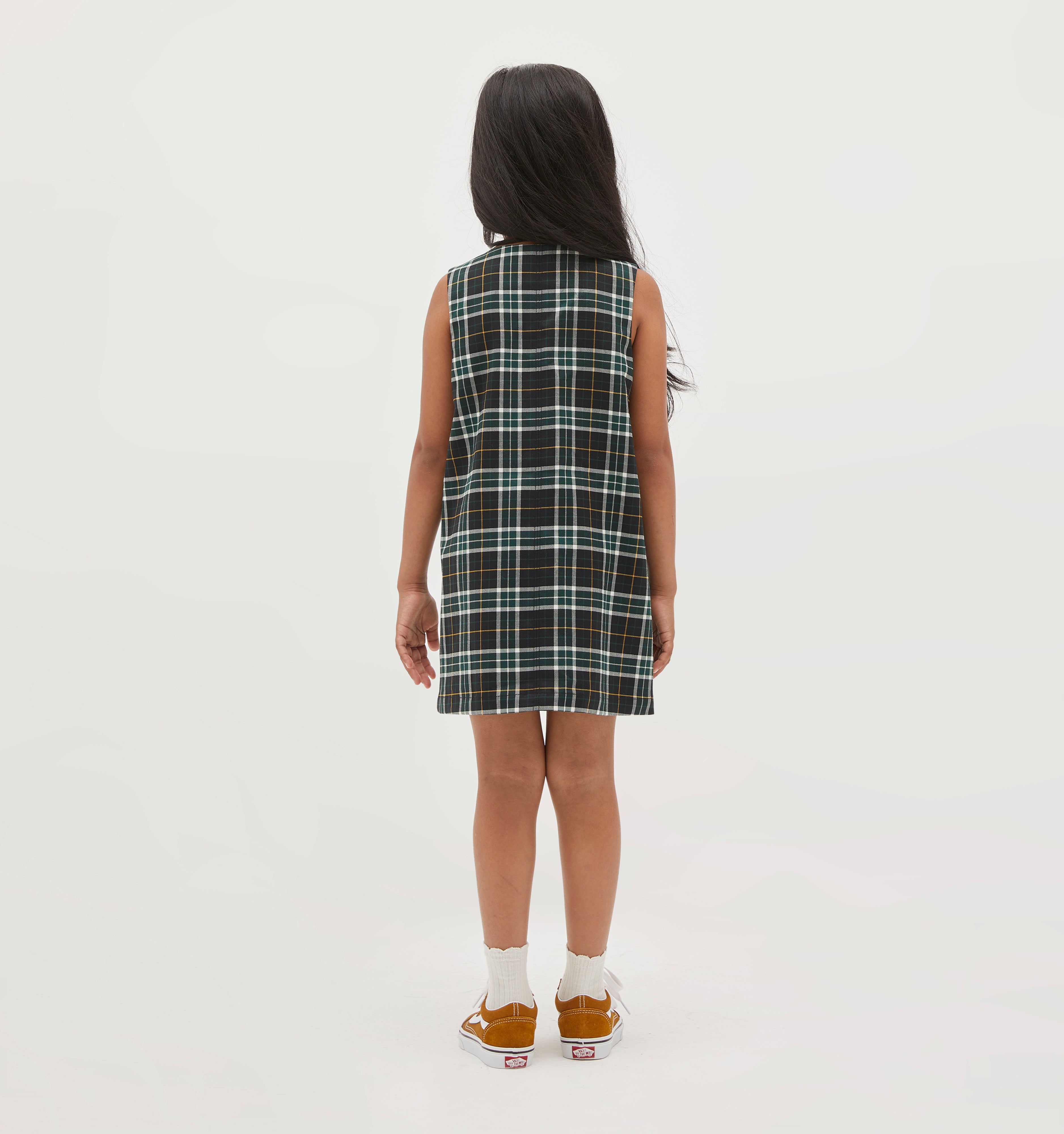 Amelia wears a 5/6Y in the Green Wallace Plaid color: green wallace plaid