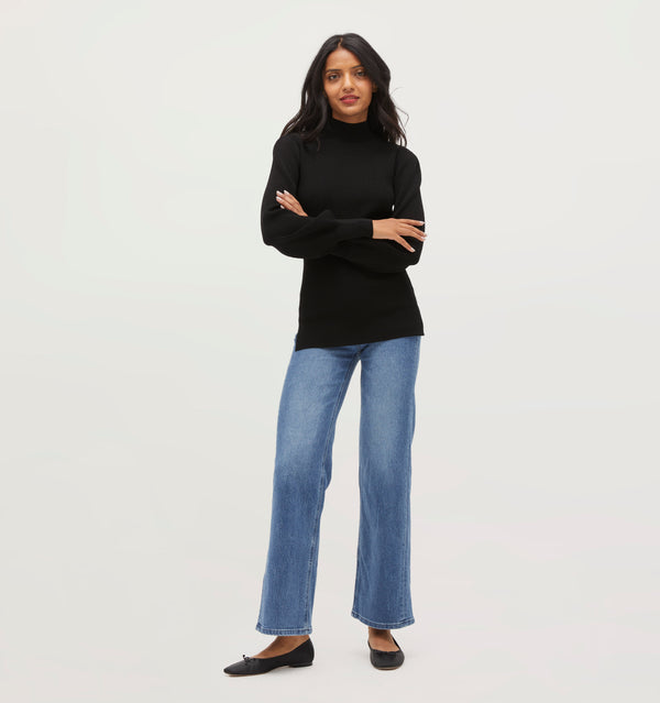 Palak is 5' 9.5" and wears a size XS in the Black Rib Knit color: Black Rib Knit