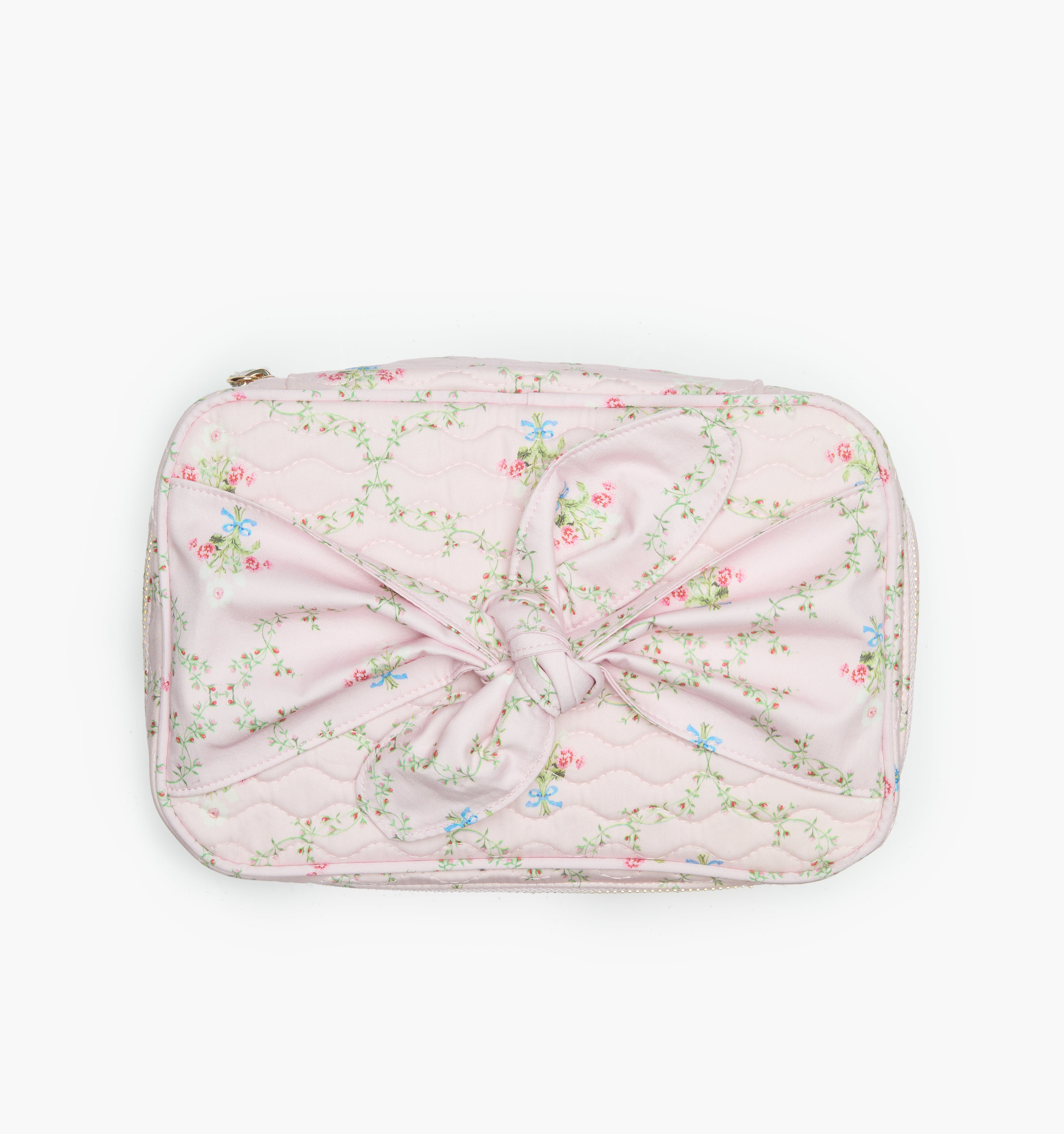 The Bow Top Quilted Cosmetic Bag in Pink Trellis color: Pink Trellis
