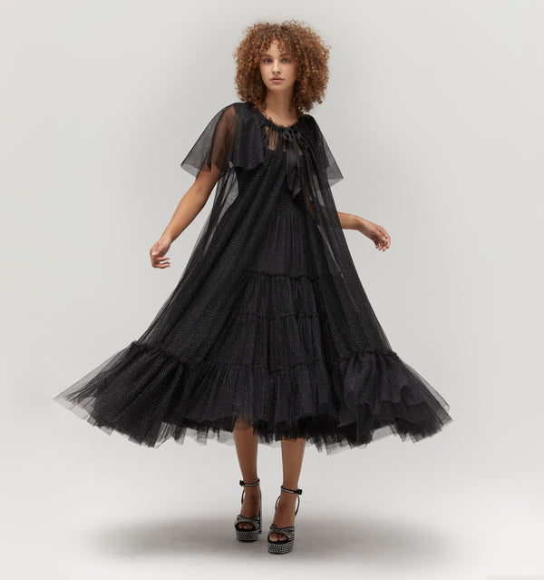 Gabriella is 5' 9.5" and wears a size XS in the Black Glitter Tulle color: Black Glitter Tulle