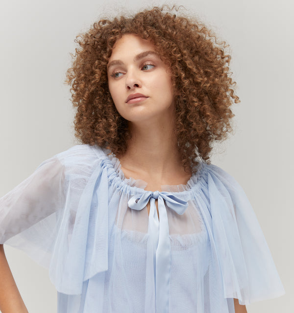 Gabriella is 5' 9.5" and wears a size XS in the Powder Blue Tulle color: Powder Blue Tulle