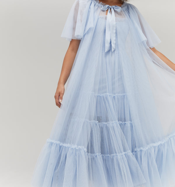 Gabriella is 5' 9.5" and wears a size XS in the Powder Blue Tulle color: Powder Blue Tulle