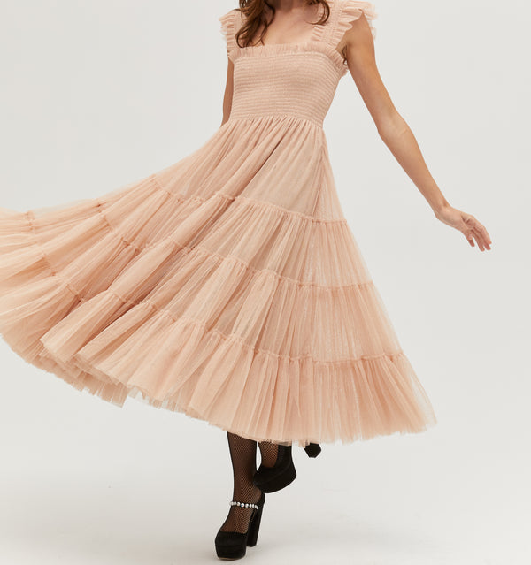 Jasmine is 5' 9" and wears a size XS in the Blush Glitter Tulle color:  Blush Glitter Tulle