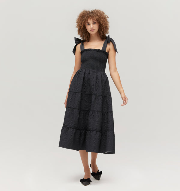 Gabriella is 5' 9.5" and wears a size XS in the Black Puffy Jacquard color: Black Puffy Jacquard