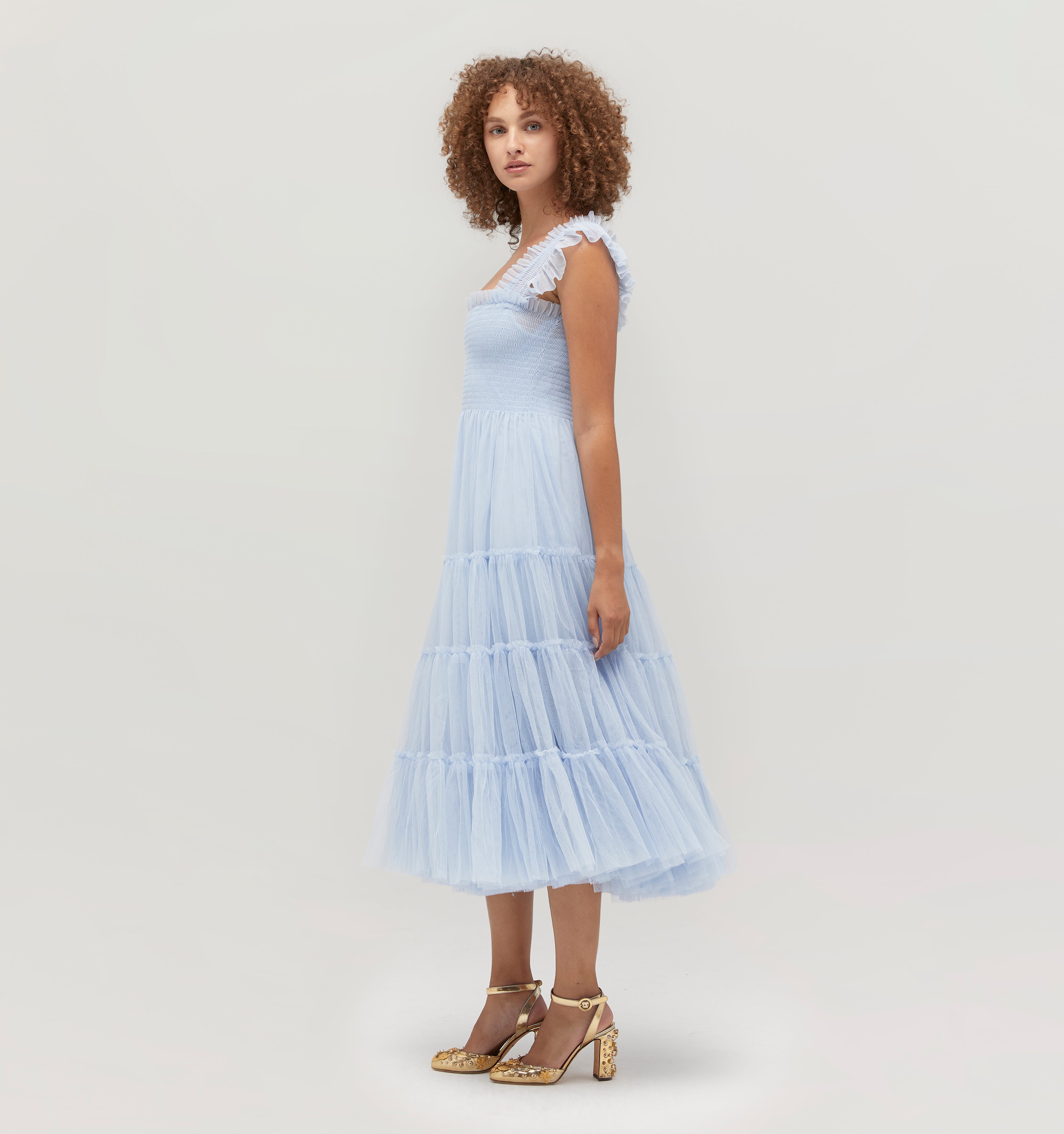 Gabriella is 5' 9.5" and wears a size XS in the Powder Blue Tulle color: Powder Blue Tulle 