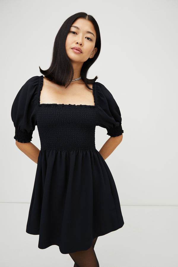 Sophia wears a size XS in the Black Crepe color:Wrinkle Resistant Black Crepe