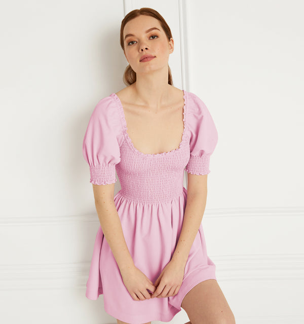 Anastasia wears and XS in the Ballerina Pink Crepe color:Ballerina Pink Crepe