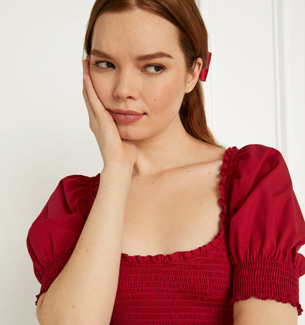 Anastasia wears and XS in the Victorian Red Cotton color: Victorian Red Cotton