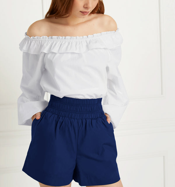 Anastasia wears and XS in the Navy Cotton color:navy cotton