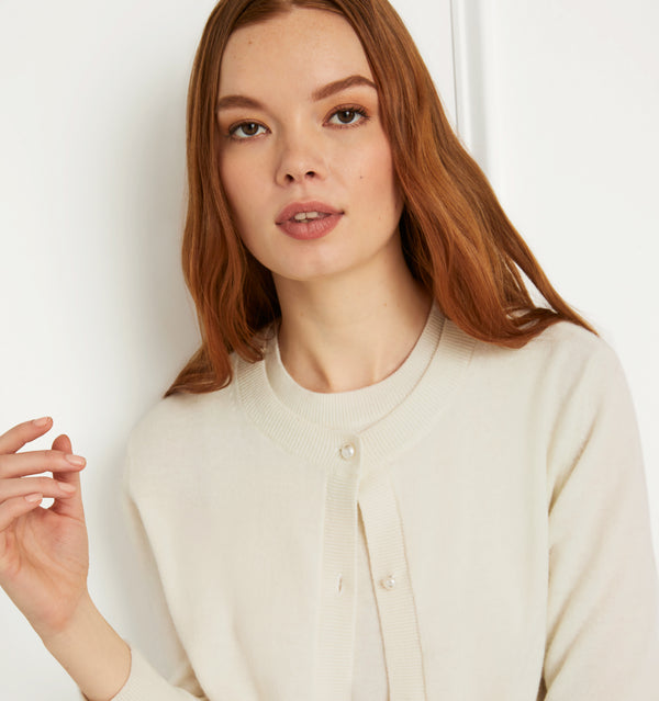 Anastasia wears and XS in the Creme Merino Wool color:creme merino wool