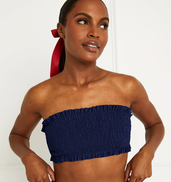 Olivia wears a S in the Navy color:navy