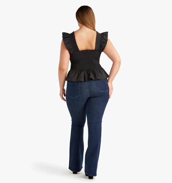 Wren wears an L in the Black color:black poplin
