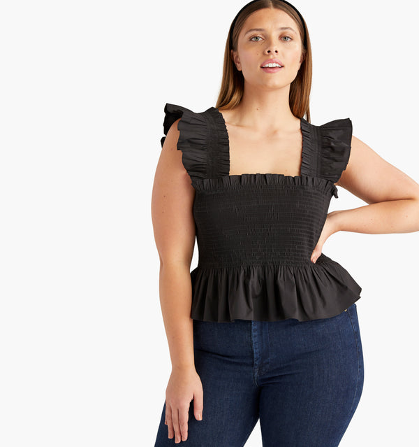 Wren wears an L in the Black color:black poplin