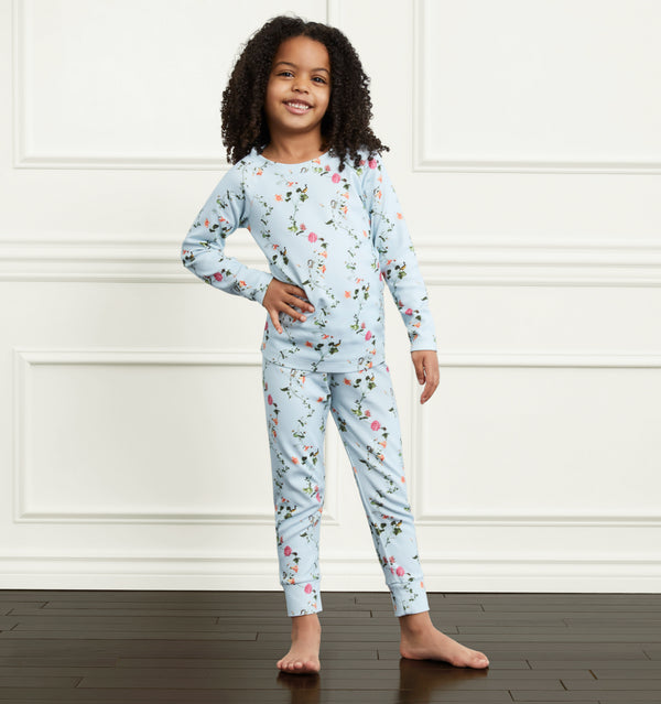 Syx wears a 5/6Y in the Pond Floral color:pond floral