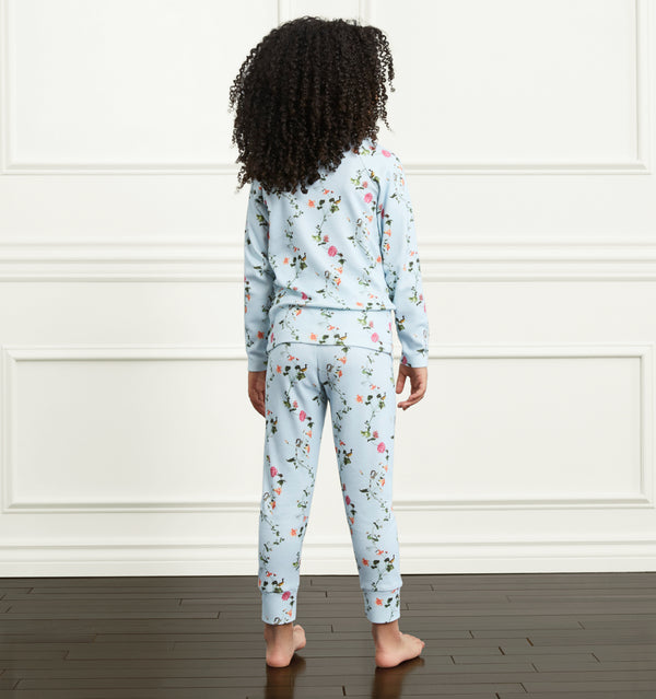 Syx wears a 5/6Y in the Pond Floral color:pond floral